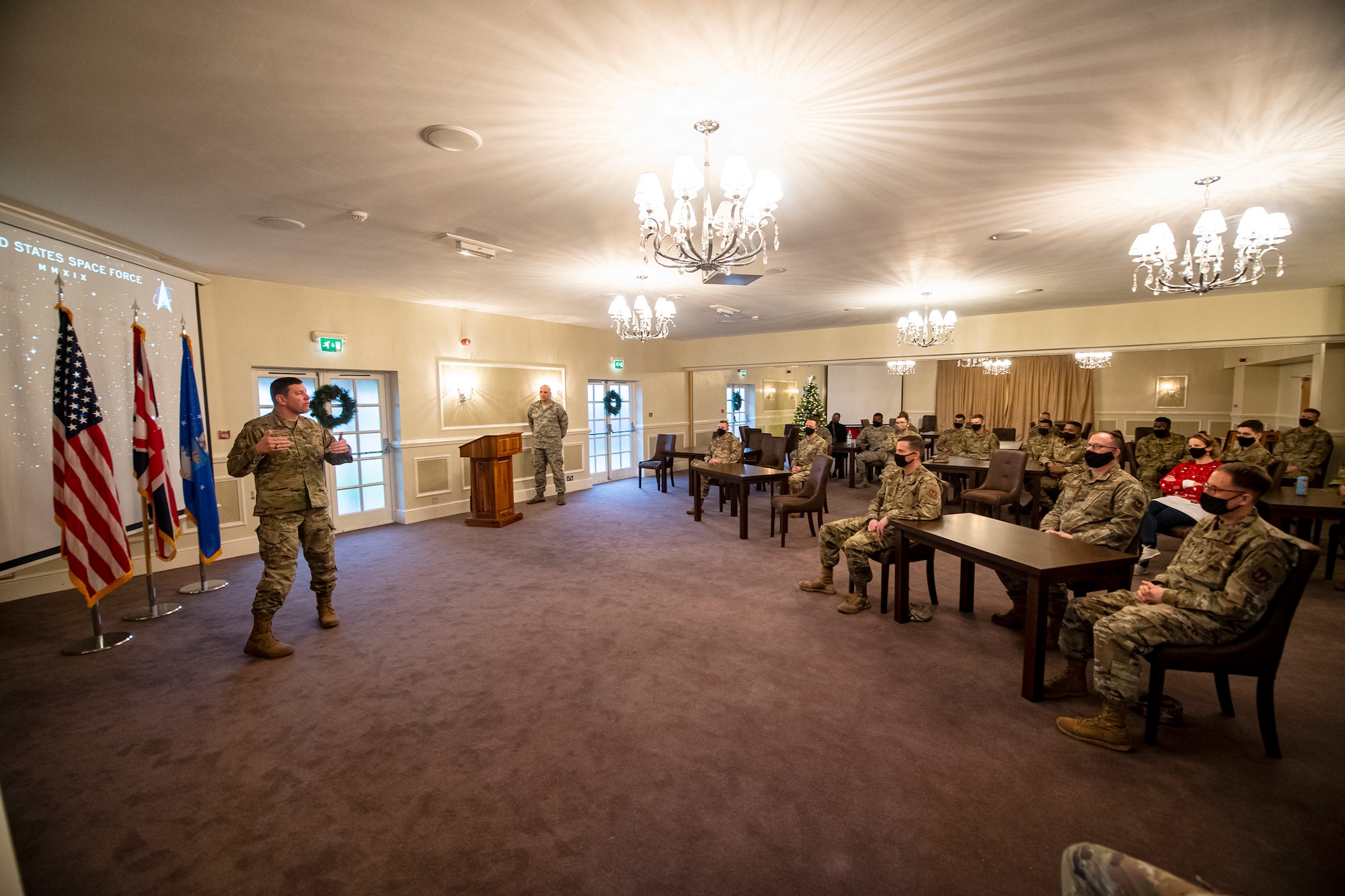 U.S. Air Force Col. Kurt Wendt, left, 501st Combat Support Wing commander, speaks during a United States Space Force induction ceremony at RAF Alconbury, England, Dec. 18, 2020. It was a historic day for the 501st CSW as Senior Master Sgt. Kyle Mullen, right, 423rd Communications Squadron superintendent, became the first Airman from the 501st CSW to transition into the USSF. (U.S. Air Force photo by Senior Airman Eugene Oliver)