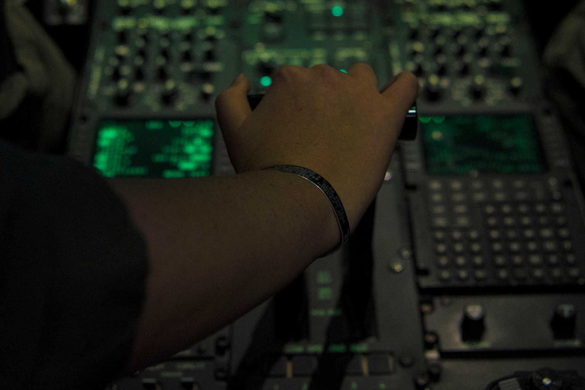 An individual starts aircraft engines in a simulator.