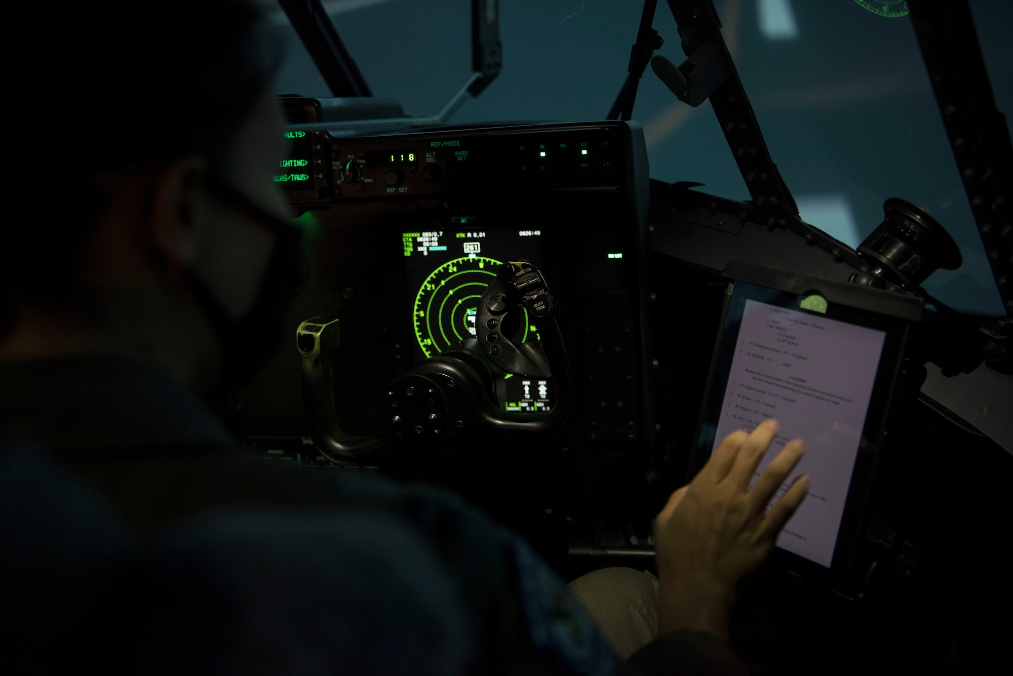 An individual uses a C-130 simulator at Ramstein Air Base, Germany.