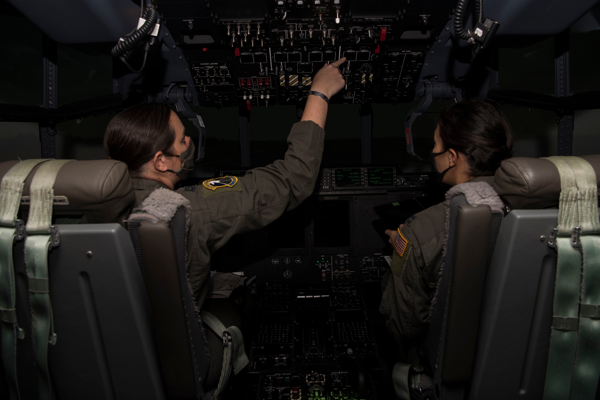 An individual uses a C-130 simulator at Ramstein Air Base, Germany.
