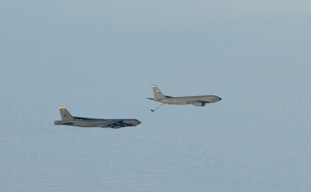 A U.S. Air Force KC-135 Stratotanker refuels a Minot Air Force Base B-52 Stratofortress during exercise Titan Fury at Fairchild Air Force Base, Washington, Dec. 11, 2020. The U.S. military’s ability to respond to global threats and emergencies would be almost impossible without the KC-135 and the men and women that keep it and themselves sharp and ready. (U.S. Air Force photo by Senior Airman Ryan Gomez)