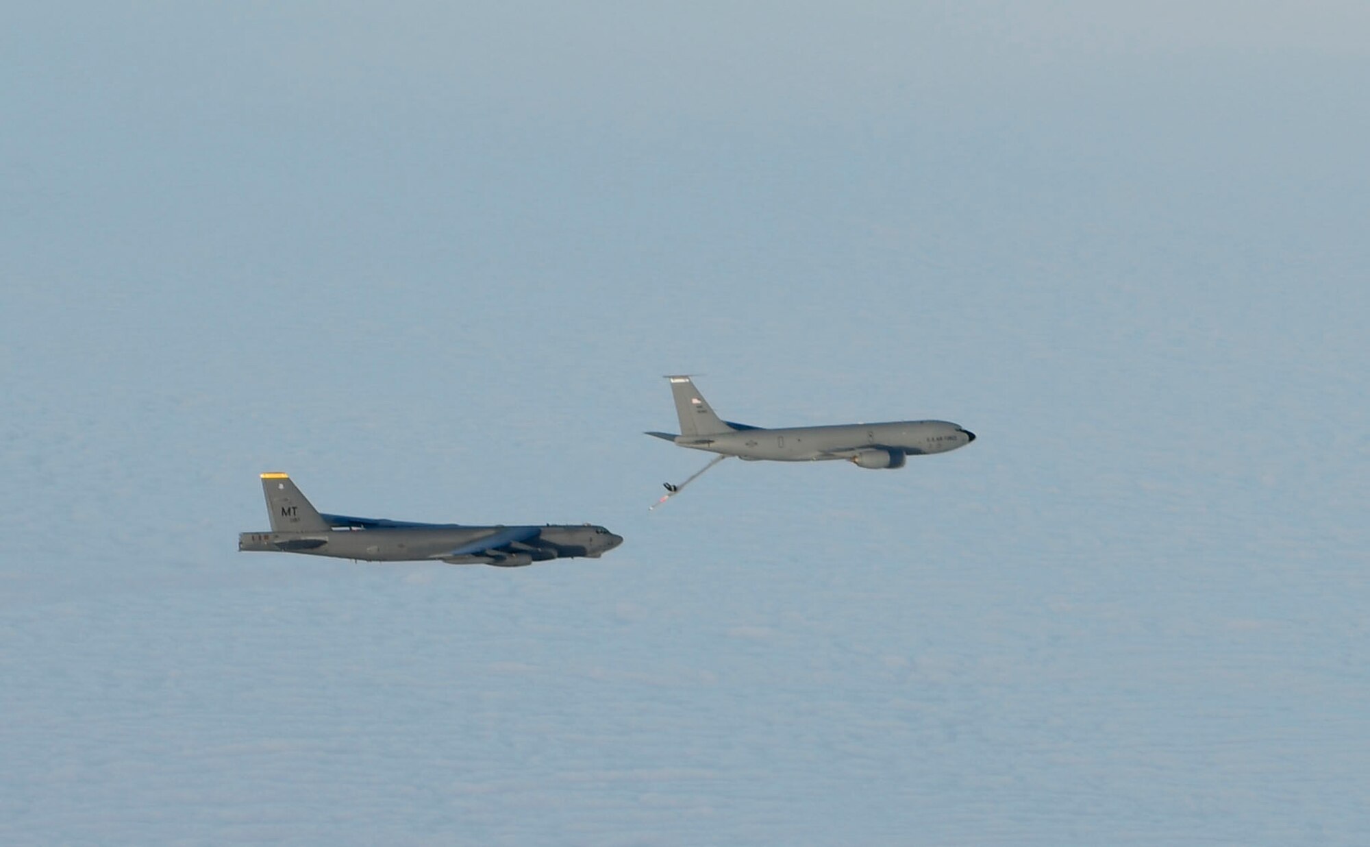 A U.S. Air Force KC-135 Stratotanker refuels a Minot Air Force Base B-52 Stratofortress during exercise Titan Fury at Fairchild Air Force Base, Washington, Dec. 11, 2020. The U.S. military’s ability to respond to global threats and emergencies would be almost impossible without the KC-135 and the men and women that keep it and themselves sharp and ready. (U.S. Air Force photo by Senior Airman Ryan Gomez)