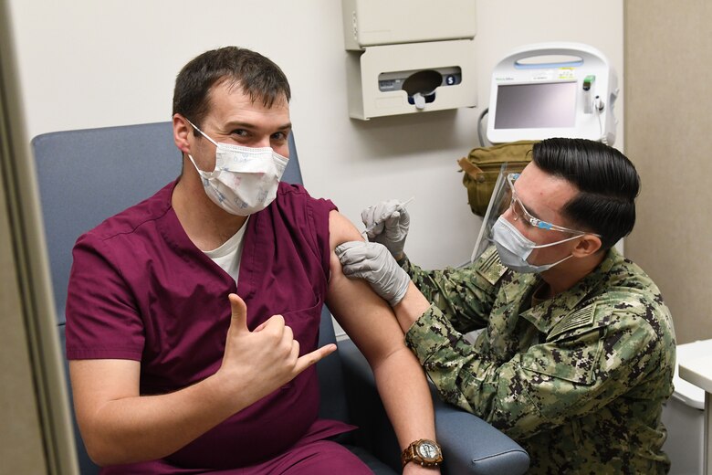 Sailor receives COVID-19 vaccine.