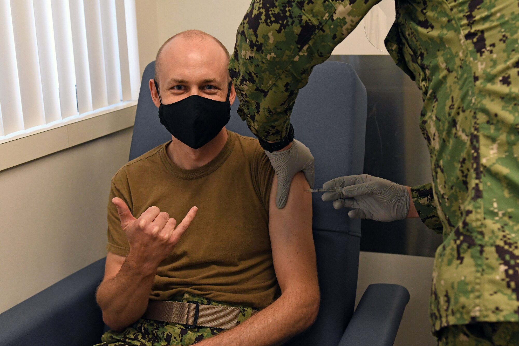 Sailor receives COVID-19 vaccine.