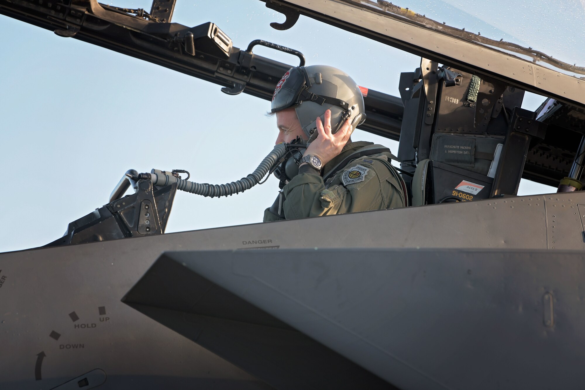 U.S. Air Force Capt. Woodruff Johnson,  494th Fighter Squadron weapons officer and recipient of the USAF Weapons School Robbie Risner Award, dons his helmet in preparation for flight at Royal Air Force Lakenheath, England, Dec. 17, 2020. The award is presented annually to the outstanding graduate of the USAF Weapons School and commemorates the leadership, courage and patriotism epitomized by Gen. Risner. (U.S. Air Force photo by Senior Airman Shanice Ship)
