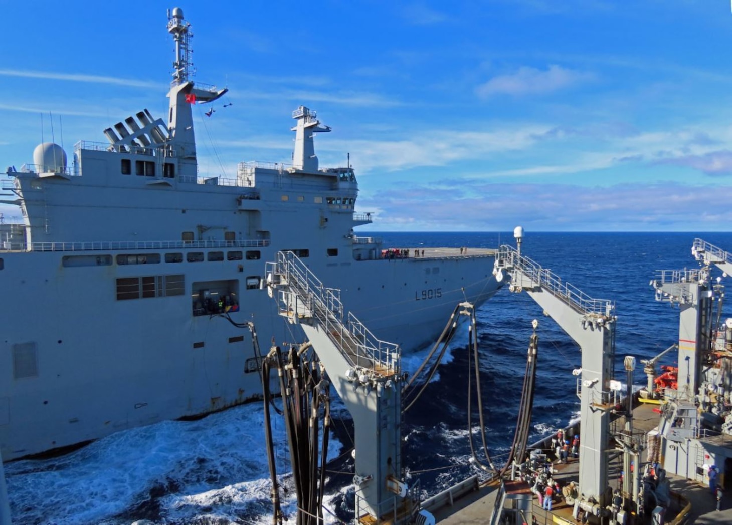 USNS Laramie (T-AO 203) completes a refueling-at-sea with French Navy LHD Dixmude (L9015) in the Atlantic Ocean, Dec. 10.