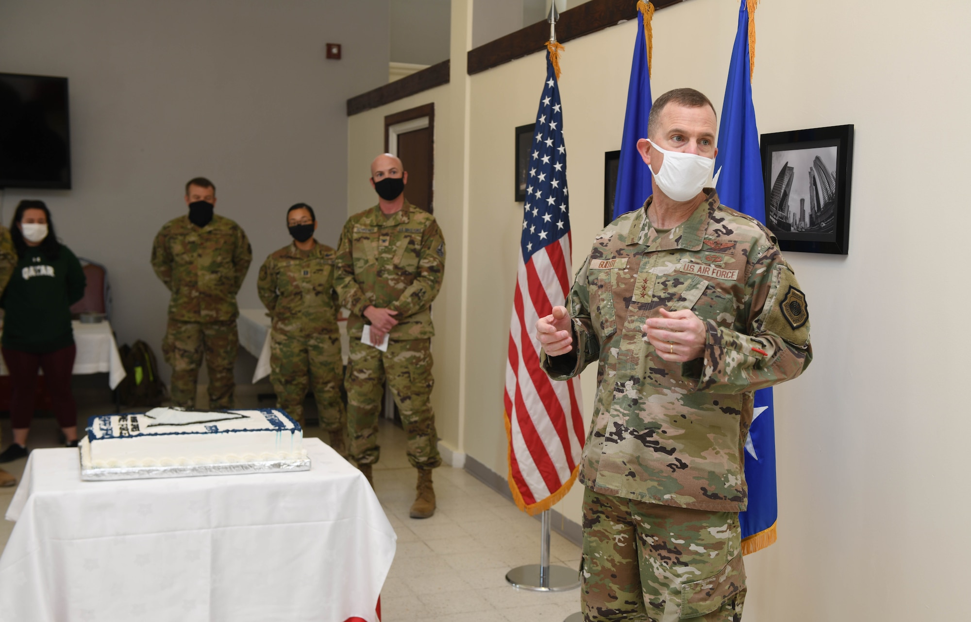 U.S. Air Force Lt. Gen. Gregory Guillot, 9th Air Force (Air Forces Central) commander,  addresses U.S. Space Force Col. Todd Benson, director of Space Forces, AFCENT, during the Space Force first birthday celebration on Dec. 20, 2020, at Al Udeid Air Base, Qatar. Guillot highlighted the accomplishments of Benson, who oversaw the swearing in of the first deployed enlisted and commissioned Space Force members who transitioned from the U.S. Air Force on Sept. 1, 2020. The Space Force became the newest branch of the U.S. military to be established in more than 70 years, with a dedicated space warfare and space operations mission. (U.S. Air Force photo by Staff Sgt. Kayla White)