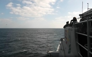 The guided-missile cruiser USS Port Royal (CG 73), deployed to U.S. Fifth Fleet and operating in direct support to Combined Maritime Forces (CMF) CTF-150, observe as a visit, board, search and seize (VBSS) team interdicts a dhow suspected of narcotics smuggling in the international waters of the North Arabian Sea, Dec. 18. CMF is a multinational maritime partnership which exists to counter illicit non-state actors on the high seas, promoting security, stability and prosperity in the Arabian Gulf, the Red Sea, Gulf of Aden, Indian Ocean and Gulf of Oman. CTF 150 conducts maritime security operations outside the Arabian Gulf to disrupt criminal and terrorist organizations, ensuring legitimate commercial shipping can transit the region free from non-state threats.