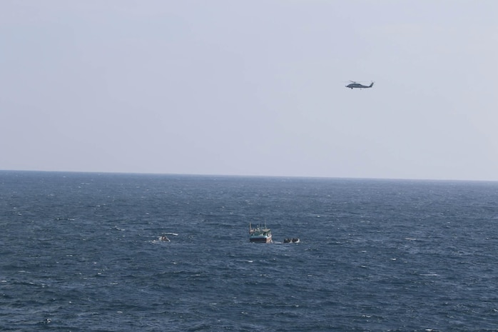 The guided-missile cruiser USS Port Royal (CG 73), deployed to U.S. Fifth Fleet and operating in direct support to Combined Maritime Forces (CMF) CTF-150, visit, board, search and seize (VBSS) team interdicts a dhow suspected of narcotics smuggling in the international waters of the North Arabian Sea, Dec. 18. CMF is a multinational maritime partnership which exists to counter illicit non-state actors on the high seas, promoting security, stability and prosperity in the Arabian Gulf, the Red Sea, Gulf of Aden, Indian Ocean and Gulf of Oman. CTF 150 conducts maritime security operations outside the Arabian Gulf to disrupt criminal and terrorist organizations, ensuring legitimate commercial shipping can transit the region free from non-state threats.