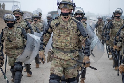 Soldiers with Troop B, 1st Squadron, 113th Cavalry Regiment, Iowa Army National Guard, prepare to conduct obstacle and barrier removal training at Camp Marechal de Lattre De Tassigny in Kosovo on Dec. 16, 2020. U.S. forces serving in support of NATO’s Kosovo Force provided crowd and riot control support as their Ukrainian counterparts removed barriers. KFOR ensures a safe and secure environment in Kosovo through regular preparation and training with multinational forces.