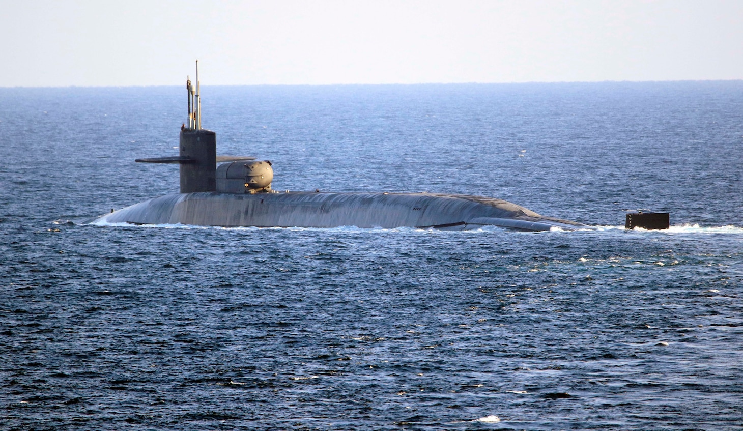 The guided-missile submarine USS Georgia (SSGN 729) transits the Strait of Hormuz, Dec. 21. Georgia is deployed to the U.S. 5th Fleet area of operations in support of naval operations to ensure maritime stability and security in the Central Region, connecting the Mediterranean and Pacific through the Western Indian Ocean and three critical chokepoints to the free flow of global commerce.