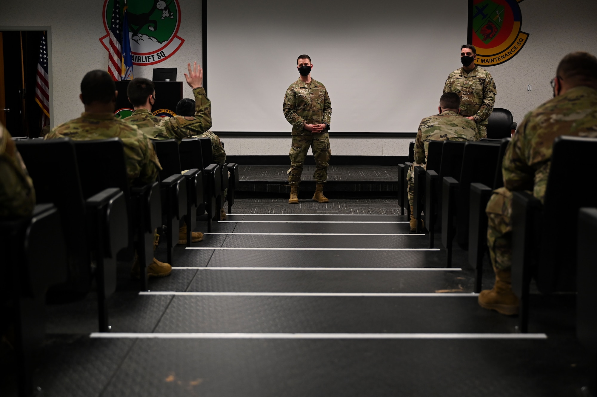 The installation commander speaks with students in an auditorium.