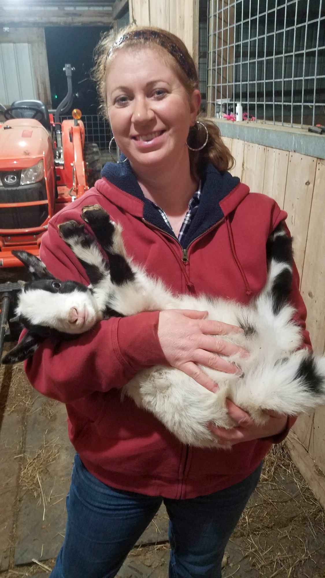 Marcy Releford, an administrative assistant for the Base Operations and Support Branch at Arnold Air Force Base, holds one of the 20 Nigerian dwarf goats she cares for on her 7.5-acre farm in Morrison, Tenn. In addition to goats, Releford also raises bantam Cochin chickens. (Courtesy photos)