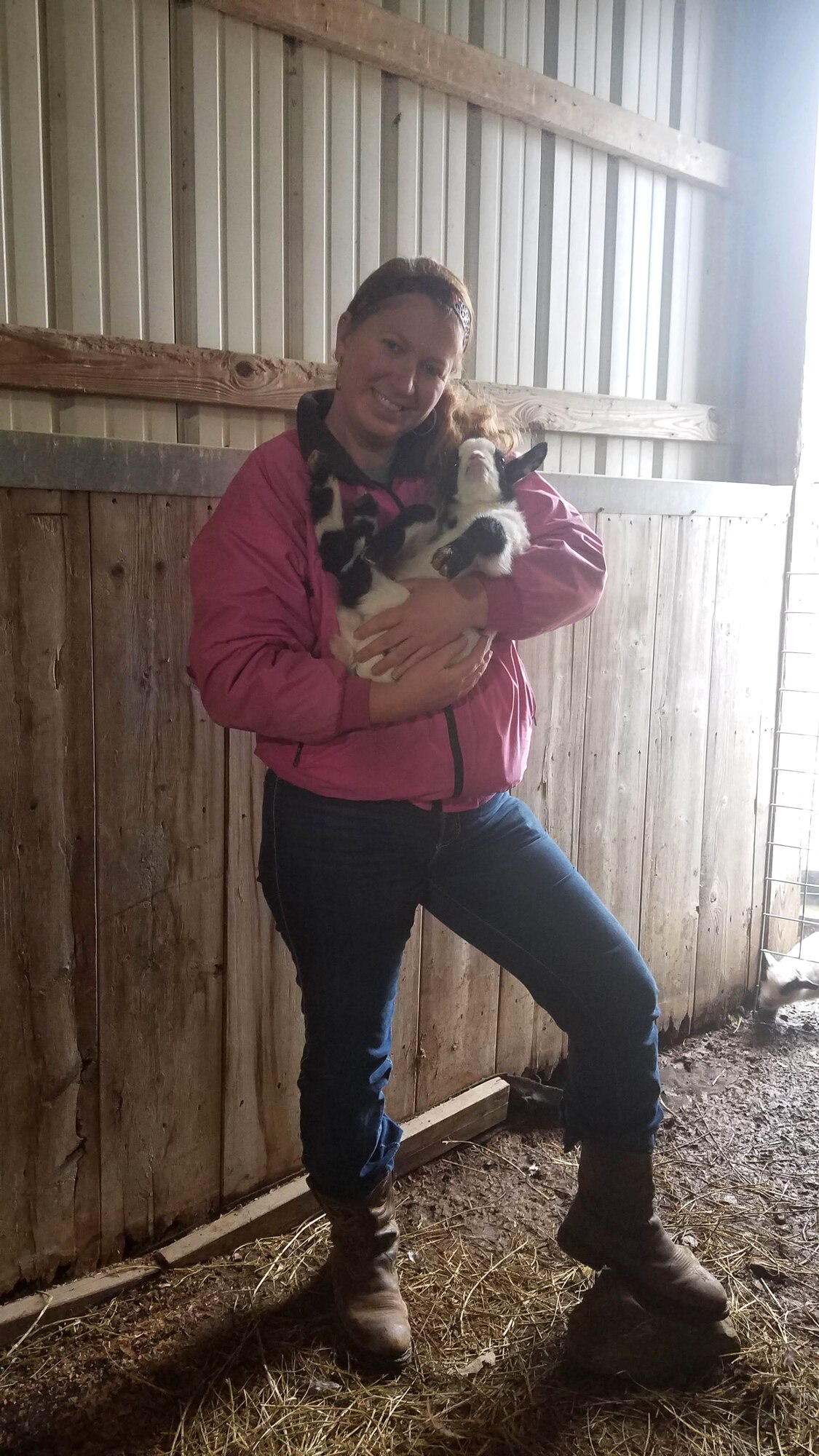 Marcy Releford, an administrative assistant for the Base Operations and Support Branch at Arnold Air Force Base, holds one of the 20 Nigerian dwarf goats she cares for on her 7.5-acre farm in Morrison, Tenn. In addition to goats, Releford also raises bantam Cochin chickens. (Courtesy photo)