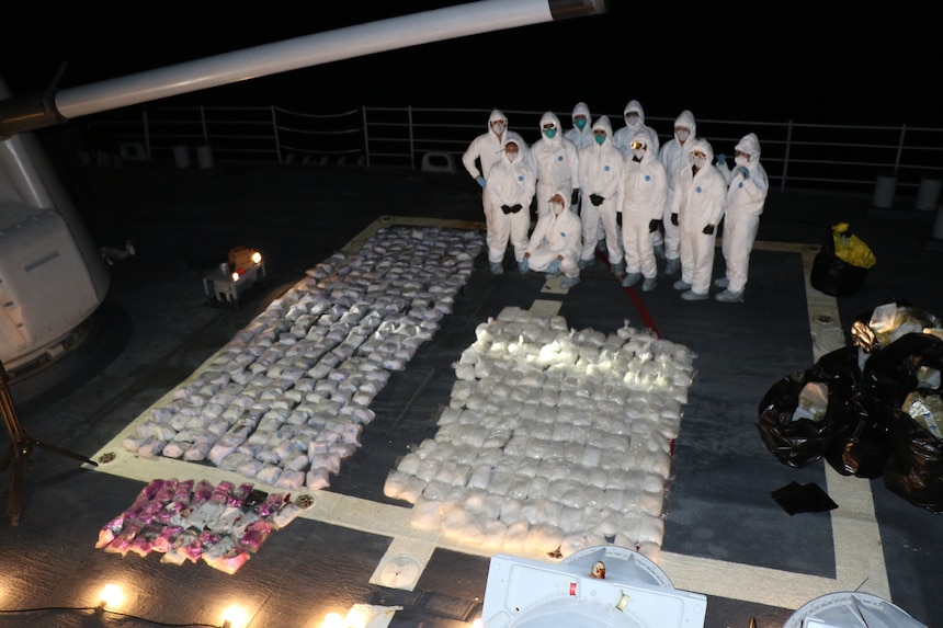 Sailors assigned to the visit, board, search and seizure (VBSS) team and the “Easyriders” of Helicopter Maritime Strike Squadron Three Seven (HSM-37) pose following an illicit narcotics seizure from a dhow in the international waters of the North Arabian Sea, Dec.