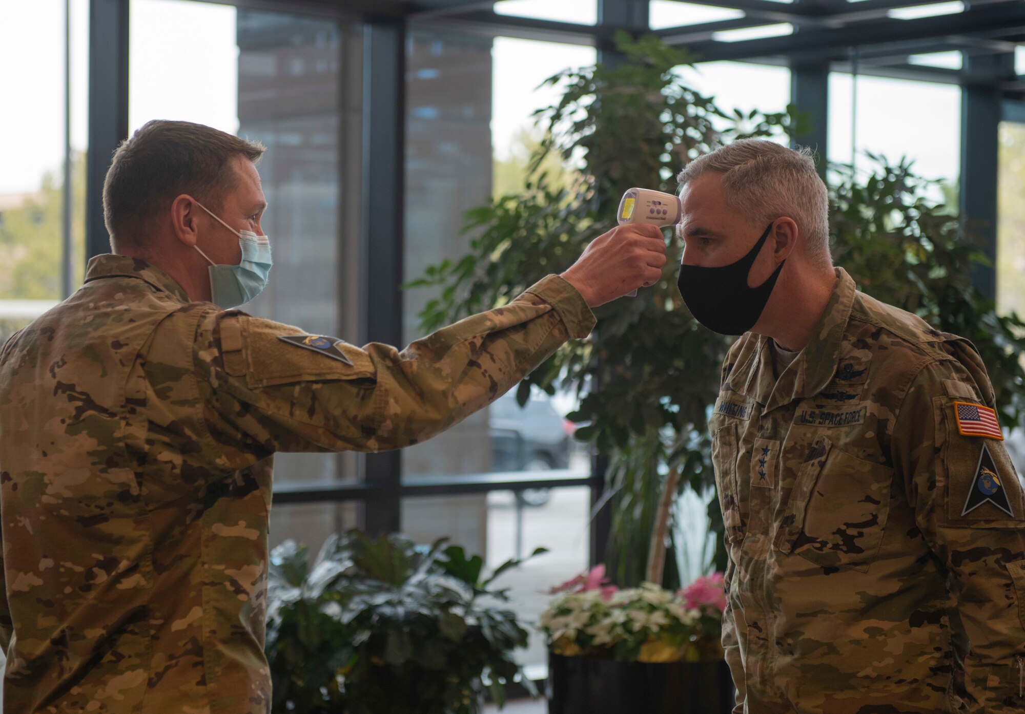 Commander of Space Operations Command gets his temperature checked