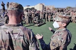 Lt. Col. Manuel Menendez (right), 232nd Medical Battalion Commander, briefs Gen. Paul Funk II (left), U.S. Army Training and Doctrine commander, on the Battalion’s Best Advanced Individual Training Medic Competition at Joint Base San Antonio-Fort Sam Houston Dec. 17.