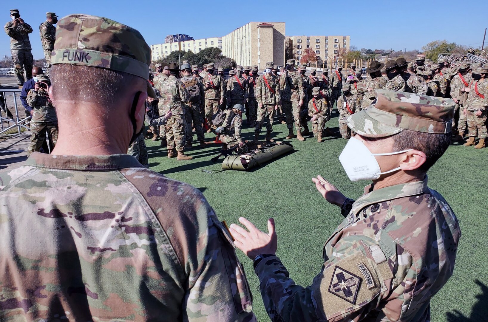 Lt. Col. Manuel Menendez (right), 232nd Medical Battalion Commander, briefs Gen. Paul Funk II (left), U.S. Army Training and Doctrine commander, on the Battalion’s Best Advanced Individual Training Medic Competition at Joint Base San Antonio-Fort Sam Houston Dec. 17.