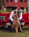 Through his "Santa Todd" persona, Todd Bishop, a U.S. Army Medical Materiel Agency civilian employee, has found new ways to use technology to continue bringing holiday magic to children -- and maybe even their K-9 friends -- during the holidays despite COVID-19 restrictions. (Photo Credit: Courtesy Todd Bishop)