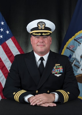 Commander Justin M. Santos