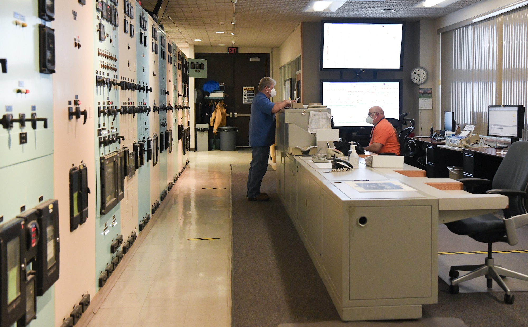 Arnold Engineering Development Complex electrical distribution dispatchers Tom Payne, left, and Mitch Kendrick monitor the power usage at Arnold Air Force Base, Tenn., Sept. 10, 2020, in order to coordinate demand with the Tennessee Valley Authority. The AEDC Base Civil Engineering Branch ensures utilities for both testing and support are available when needed. (U.S. Air Force photo by Jill Pickett)