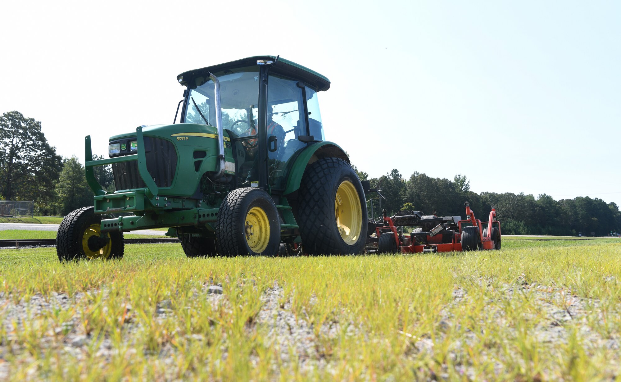 A member of Team AEDC mows grass Sept. 10, 2020, at Arnold Air Force Base, Tenn. Grounds maintenance is one of the responsibilities of the Arnold Engineering Development Complex Base Civil Engineering Branch. (U.S. Air Force photo by Jill Pickett)