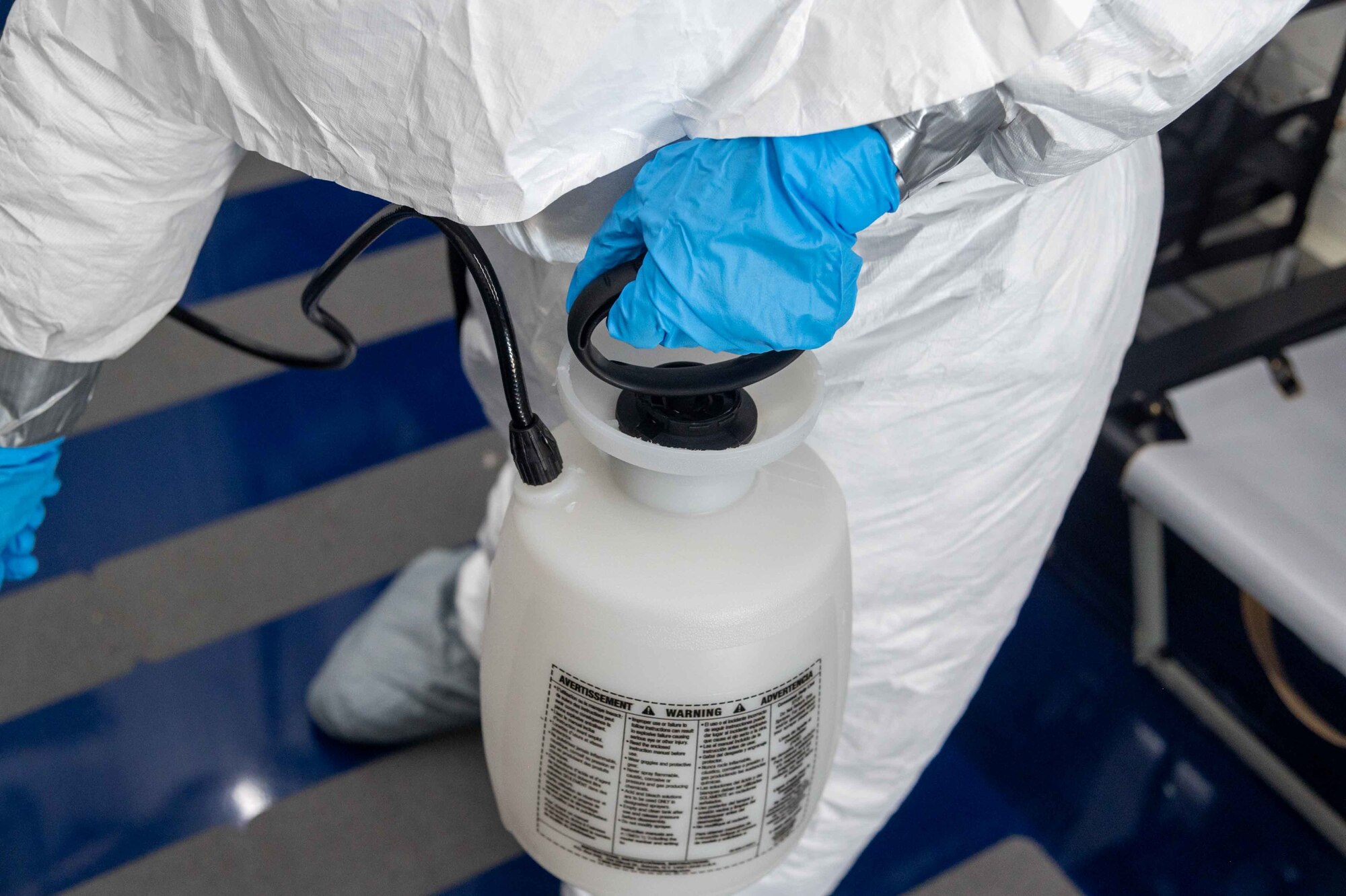 Tech. Sgt. Holly McCullough-Cruz, 775th Expeditionary Aeromedical Evacuation Flight biological containment unit noncommissioned officer in charge, decontaminates a negatively pressurized conex, Oct. 21, 2020 at Dover Air Force Base, Delaware. Dover AFB hosts two NPCs in support of COVID-19 medical evacuation operations and has transported 26 patients as of Dec. 15, 2020. (U.S. Air Force photo by Airman 1st Class Faith Schaefer)