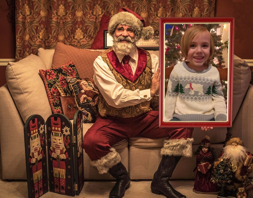 A child takes a virtual photo with Santa.