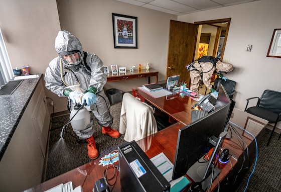 Soldiers with the West Virginia National Guard’s Task Force Chemical, Biological, Radiological and Nuclear Response Enterprise sanitize workspaces for a university office in Charleston, West Virginia, April 11. Utilizing Centers for Disease Control and Prevention environmental cleaning and disinfection recommendations, Guard members sanitized workspaces on multiple floors of the university building, helping to combat the possible spread of the coronavirus and allowing employees to safely return to work. (U.S. Army National Guard photo by Edwin L. Wriston)