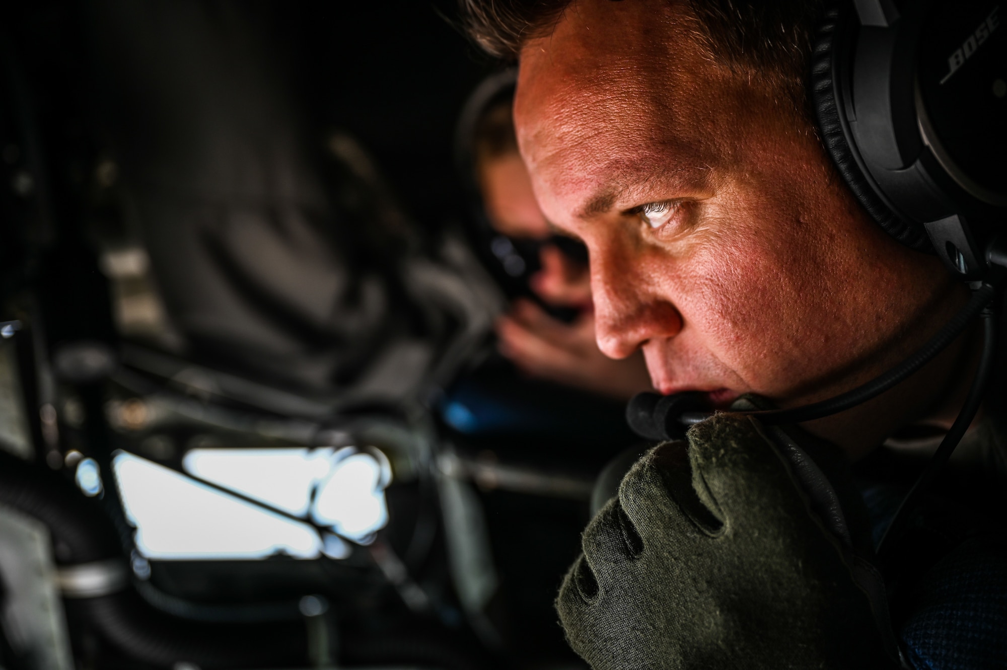 Master Sergeant Dustin Sheldon, a 91st Air Refueling Squadron boom operator, prepares to refuel various formations of fighter aircraft during week-long integrated training at Barksdale Air Force Base, La., Dec. 14, 2020.