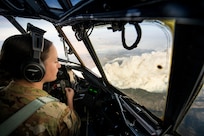 Air Force Capt. Elise Patrick, a pilot with the Wyoming Air National Guard’s 187th Airlift Wing, co-pilots a C-130 Hercules while looking down on a massive wildfire in Colorado, Oct. 16. As wildfires raged throughout the West — especially in California — National Guard members were called in to augment firefighters, protect property, provide real-time aerial images to incident command centers, drop water from helicopters and spray retardant on fires via the Modular Airborne Fire Fighting Systems, or MAFFS, from C-130 aircraft.