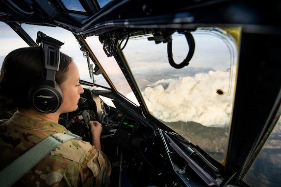 Air Force Capt. Elise Patrick, a pilot with the Wyoming Air National Guard’s 187th Airlift Wing, co-pilots a C-130 Hercules while looking down on a massive wildfire in Colorado, Oct. 16. As wildfires raged throughout the West — especially in California — National Guard members were called in to augment firefighters, protect property, provide real-time aerial images to incident command centers, drop water from helicopters and spray retardant on fires via the Modular Airborne Fire Fighting Systems, or MAFFS, from C-130 aircraft. (U.S. Air National Guard photo by Tech. Sgt. Jon Alderman)