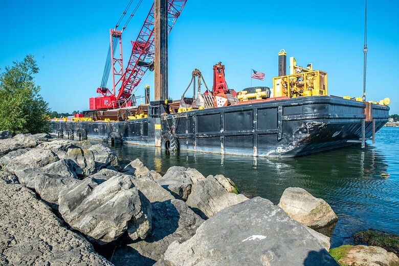 Crews work to repair the Rochester Harbor E. Pier