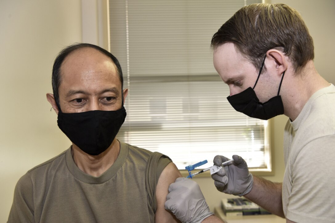Pacific Air Forces command surgeon gets a COVID-19 vaccination.