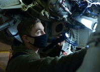 U.S. Air Force Staff Sgt. Blade Dirickson, an 18th Aircraft Maintenance Unit F-16 Fighting Falcon dedicated crew chief, inspects an F-16 before an elephant walk on Eielson Air Force Base, Alaska, Dec. 18, 2020.