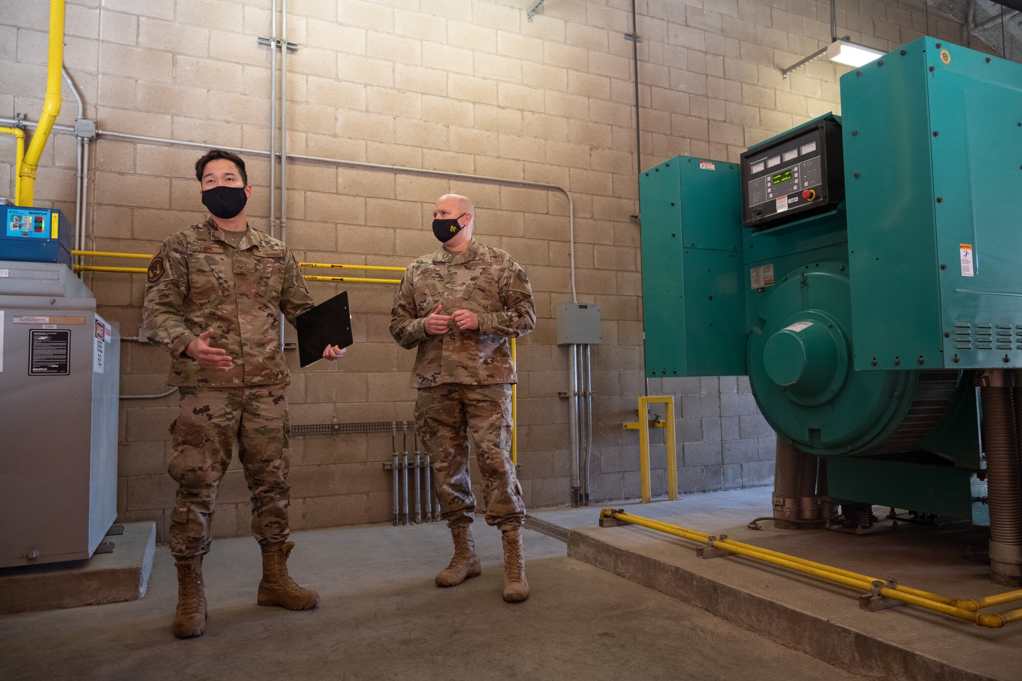 Airman briefs command chief on airfield lighting.