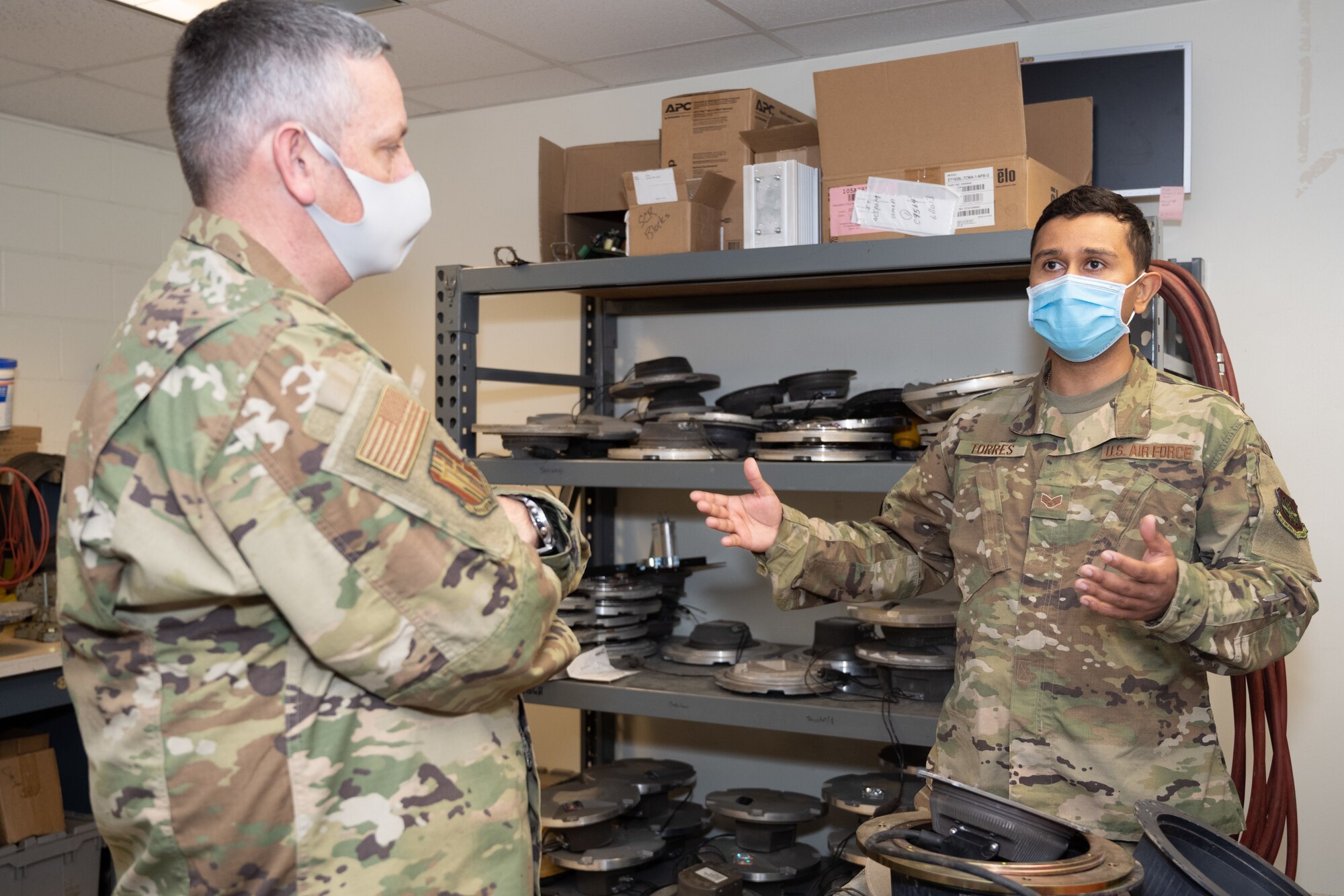 Airman briefs commander on fire alarm systems.