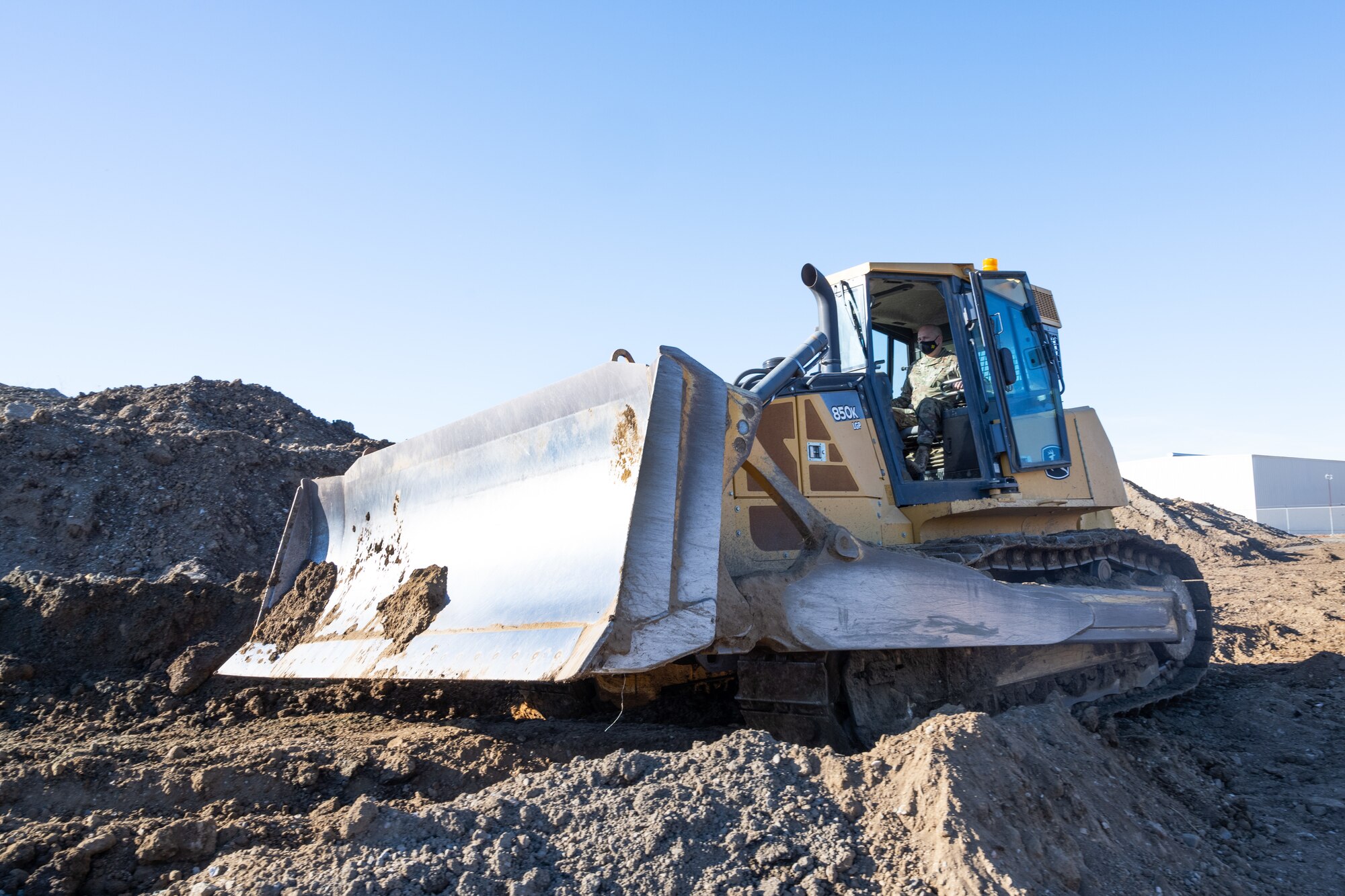 Chief driving bulldozer.