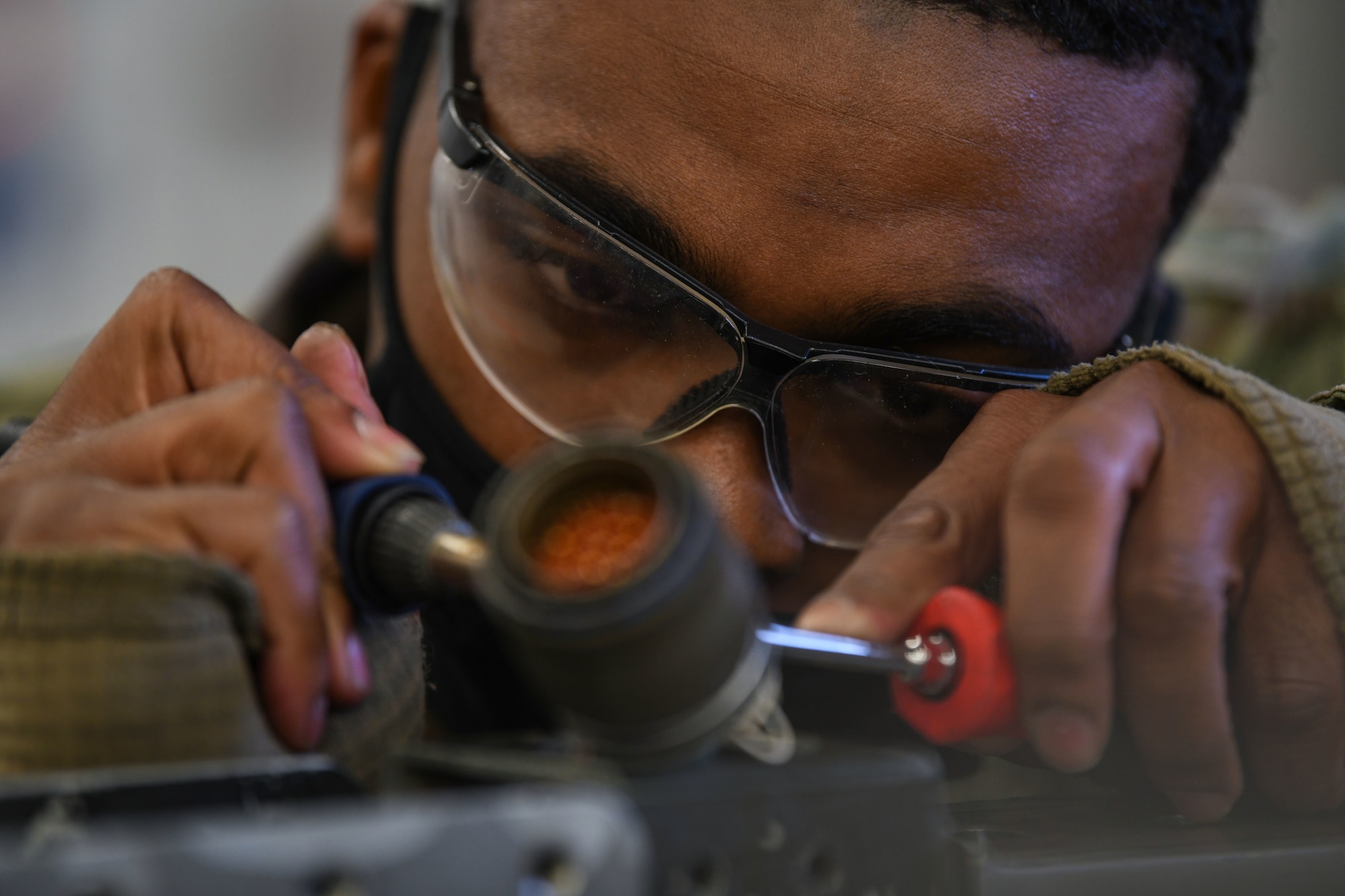 Senior Airman Timothy Strawther, 31st Munitions Squadron armament technician, solders a wire on a on a LAU-129 missile rail launcher at Aviano Air Base, Italy, Dec. 21, 2020. The 31st MUNS maintains equipment and a combat ready stockpile to support U.S. and NATO taskings. Airmen from the 31st MUNS armament flight ensure they remain mission ready throughout the COVID-19 pandemic. (U.S. Air Force photo by Airman 1st Class Ericka A. Woolever)