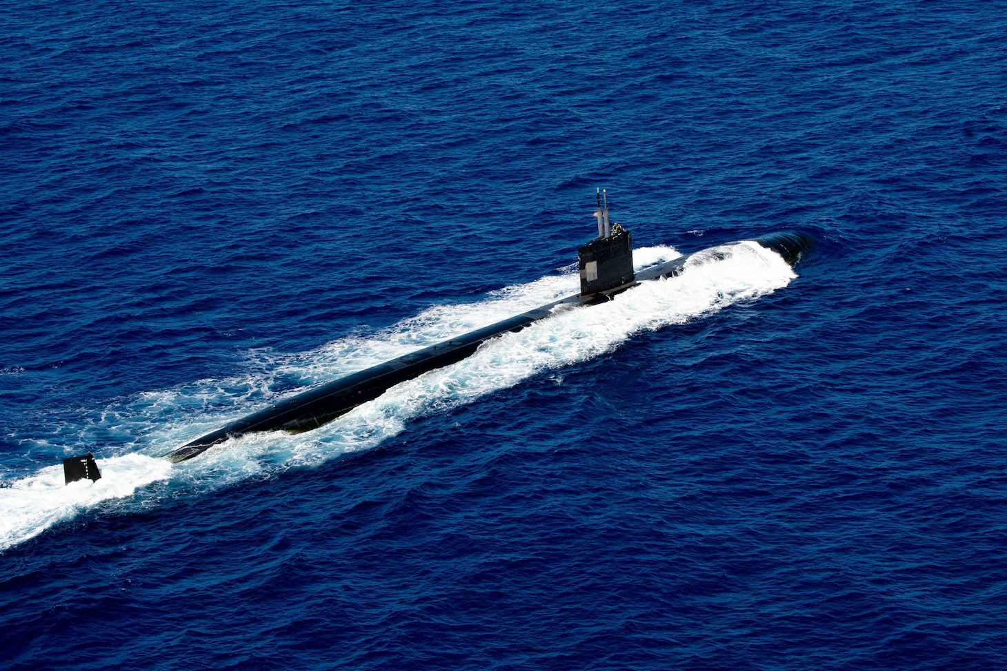 WATERS OFF GUAM (Dec. 11, 2020) The Los Angeles-class fast-attack submarine USS Asheville (SSN 758) steams off the coast of Guam during a photo exercise with the French Navy Rubis-class nuclear powered submarine (SSN) Émeraude. Asheville and Émeraude practiced high-end maritime skills in a multitude of disciplines designed to enhance interoperability between maritime forces. Asheville is one of four forward-deployed submarines assigned to Commander, Submarine Squadron 15. (U.S. Navy photo by Mass Communication Specialist 2nd Class Kelsey J. Hockenberger)