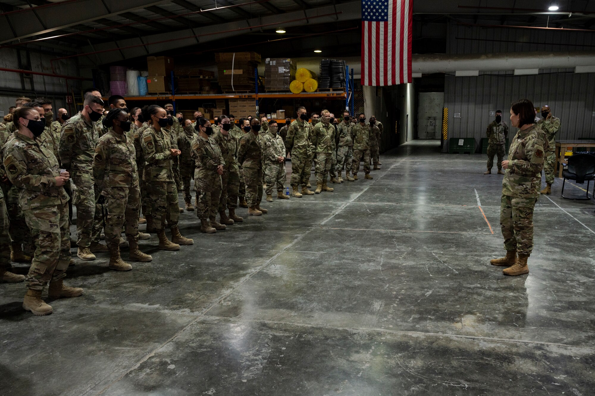Chief Master Sgt. of the Air Force JoAnne S. Bass visits with Airmen assigned to the 380th Expeditionary Logistics Readiness Squadron (ELRS) at Al Dhafra Air Base, United Arab Emirates, Dec. 21, 2020.