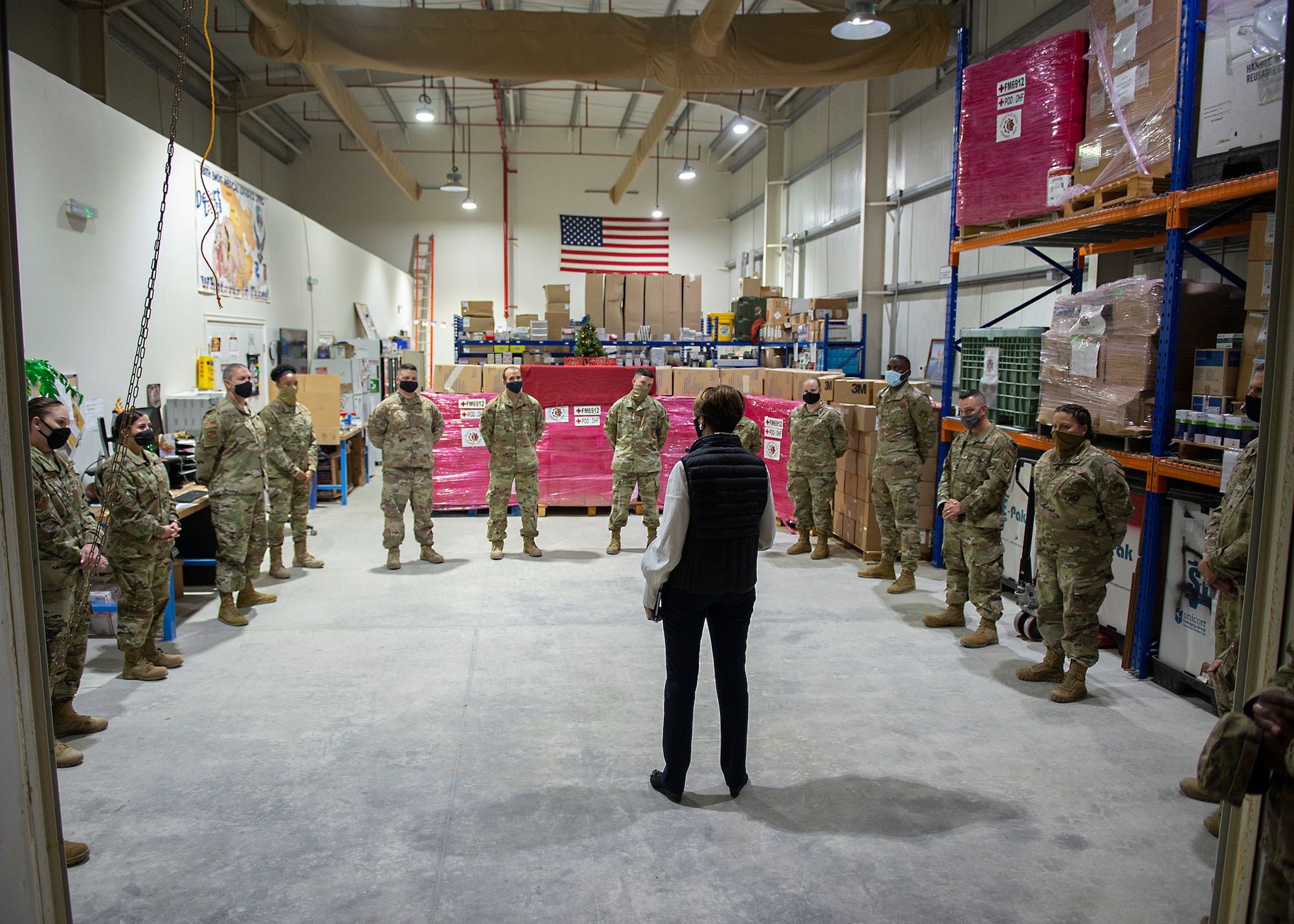Secretary of the Air Force Barbara Barrett speaks with Airmen assigned to the 380th Expeditionary Medical Group at Al Dhafra Air Base, United Arab Emirates, Dec. 21, 2020.