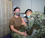 Naval Medical Center Portsmouth (NMCP) Immunization Clinic personnel administered a COVID-19 vaccination to the first East Coast waterfront Sailor, Master Chief Hospital Corpsman Blair Taylor, Dec. 21.
