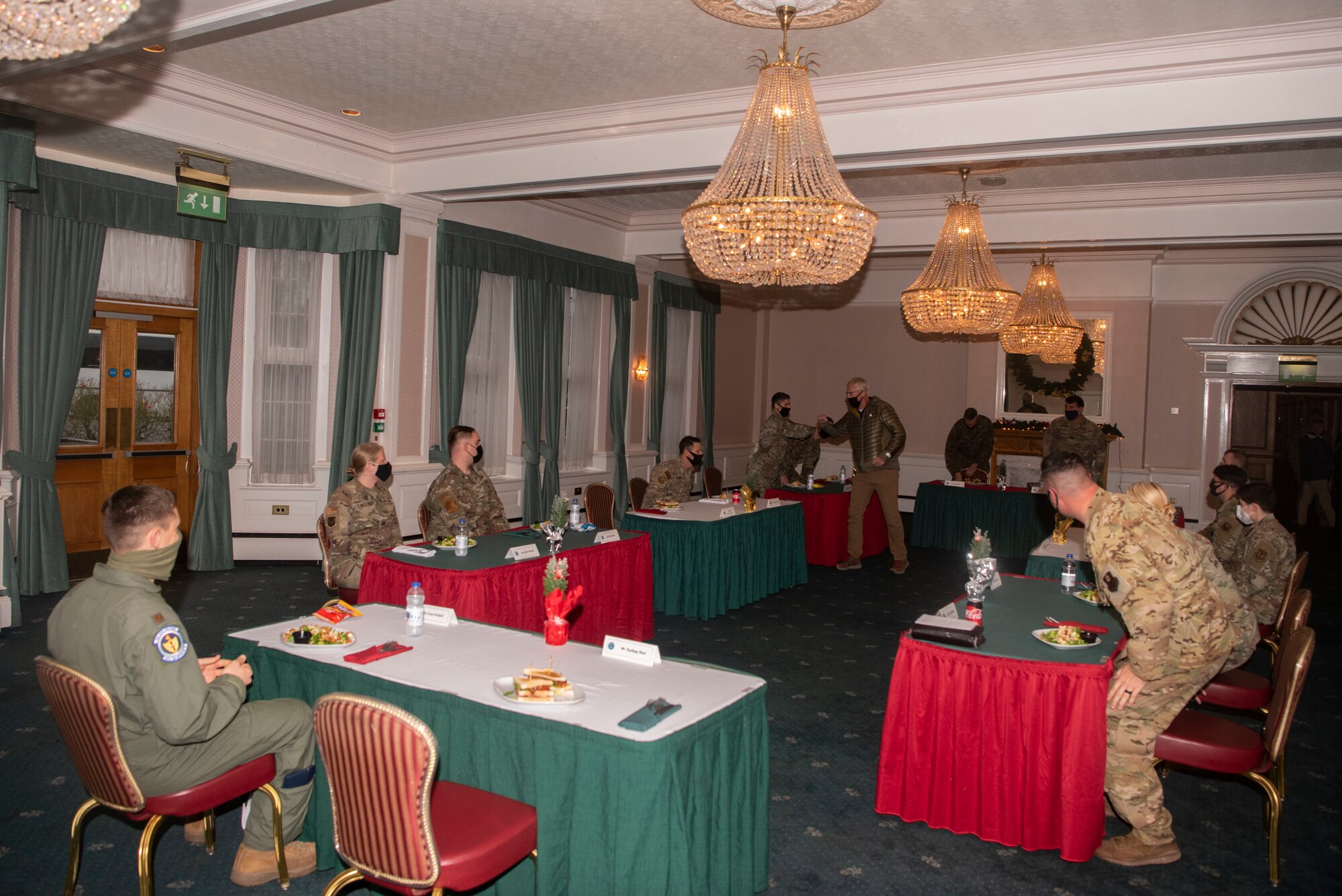 U.S. Acting Secretary of Defense Christopher Miller greets Airmen before a luncheon at Royal Air Force Mildenhall, England, Dec. 21, 2020. Miller spoke with Airmen to learn about the mission sets they accomplish and any needs they have. (U.S. Air Force photo by Airman 1st Class Joseph Barron)