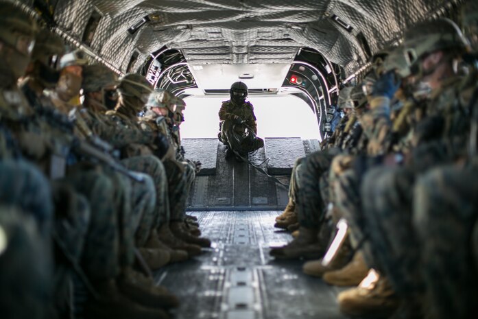 A crew chief with the Japan Ground Self-Defense Force and U.S. Marines conduct an air assault in mainland Japan, Dec. 15.