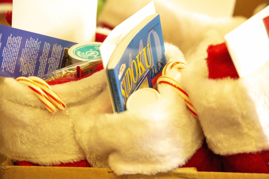 Stockings filled with gifts from the Daughters of the American Revolution are staged for delivery to Marines and Sailors with U.S. Marine Corps Forces Command on Camp Elmore, in Norfolk, Virginia, Dec. 21, 2020. The Daughters of the American Revolution is an organization with more than one million members, dedicated to making a difference in their communities, across the country, and the world. Members of the local DAR chapter collected gifts for the Marines and Sailors of U.S. Marine Corps Forces Command. (U.S. Marine Corps photo by Sgt. Desmond Martin/released)