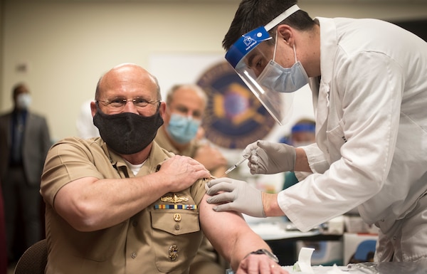 Chief of Naval Operations (CNO) Adm. Mike Gilday receives the COVID-19 vaccine.