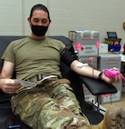 Lt. Col. Robert Beaudry donates blood during an American Red Cross blood drive at Camp Johnson, Vermont, Dec. 22, 2020. Beaudry is the deputy chief of the Vermont National Guard’s U.S. Property and Fiscal Office. (Army National Guard photo by Don Branum)