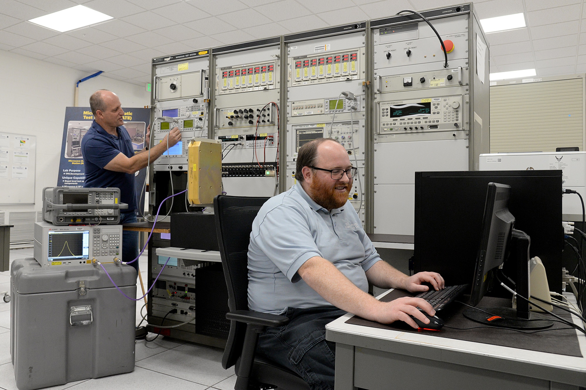 Bobby McNeal (front) and David James work together to organically develop automatic test equipment systems to support the F-16 Nov. 5, 2020, at Hill Air Force Base, Utah. The 309th Software Engineering Group has a positive and direct impact across multiple essential platforms such as the A-10, F-16, F-22, F-35, Ground Based Strategic Deterrent, Space Systems, and Command and Control.  (U.S. Air Force photo by Alex R. Lloyd)