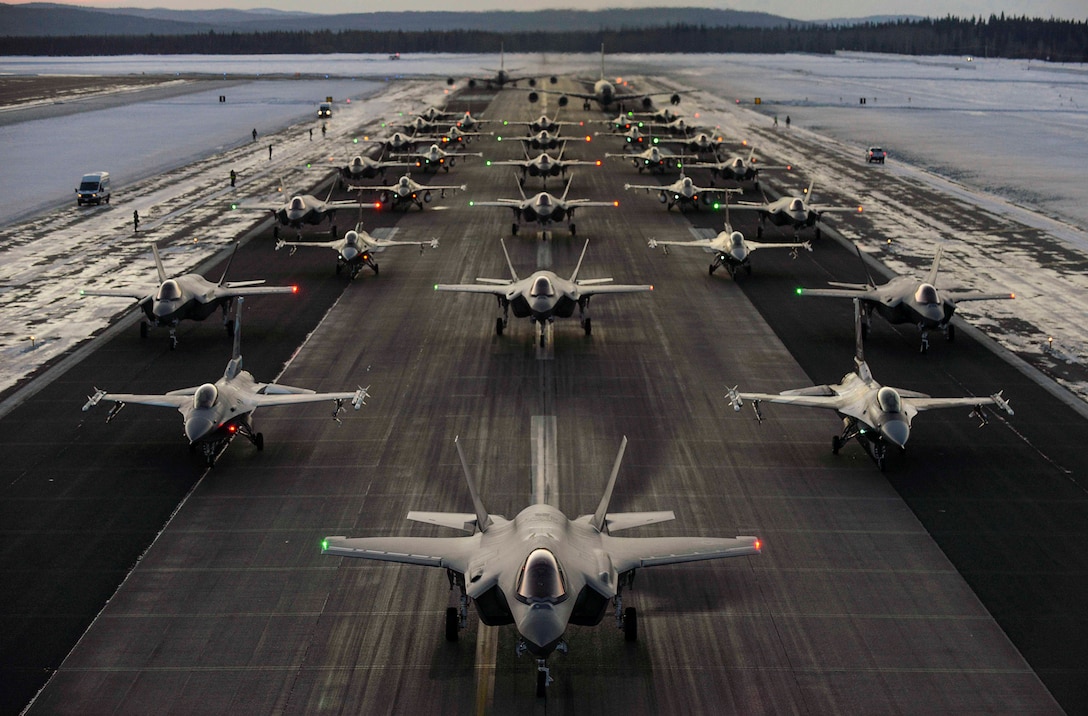 Aircraft line up in formation.